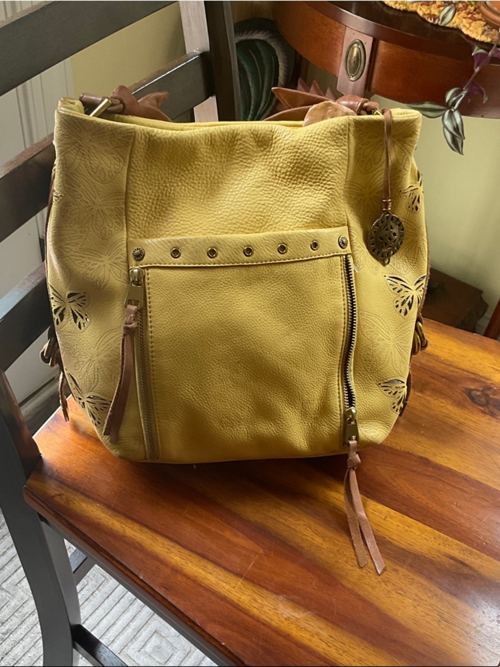 The Sak Yellow Leather Shoulder Bag with Butterfly Cutouts